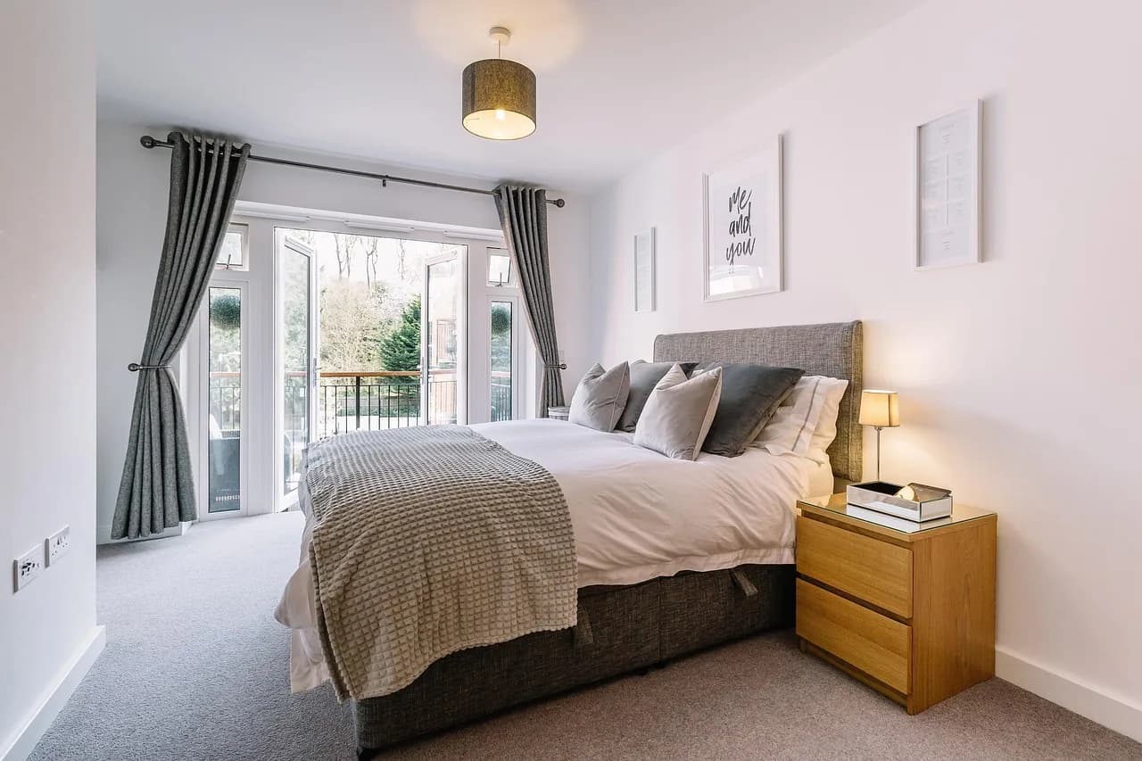 A staged bedroom in warm daylight
