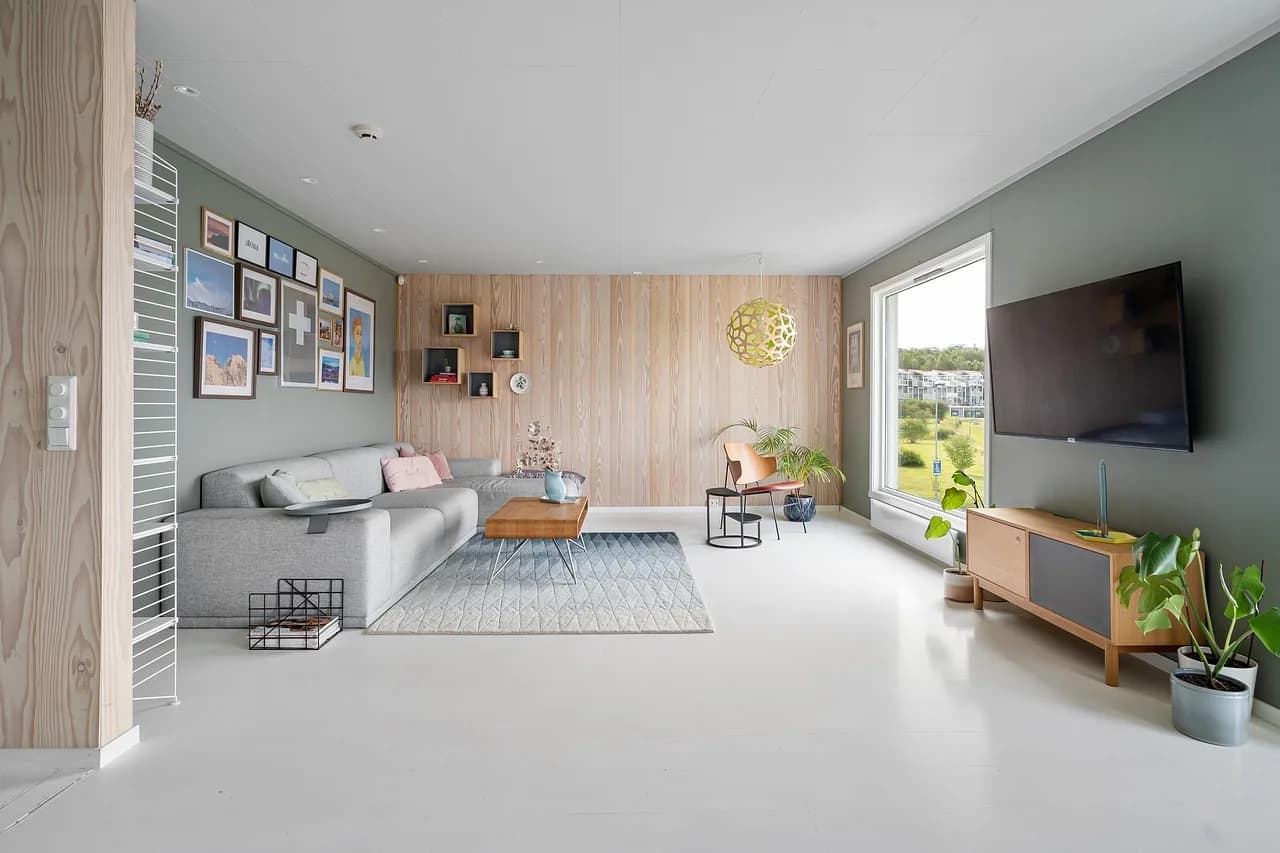 A living room with a wood feature wall